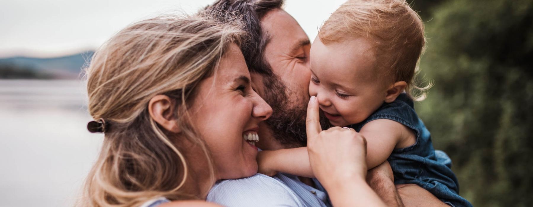 a man and woman with a child